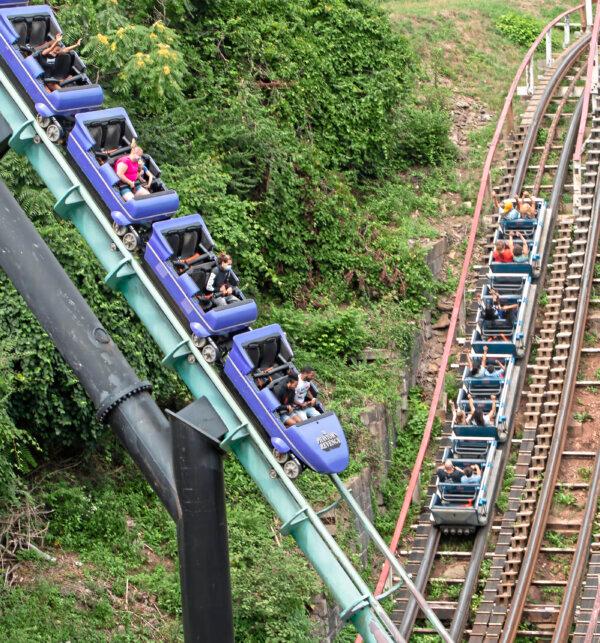 The Phantom’s Revenge goes downhill while the Thunderbolt makes its way uphill on National Roller Coaster Day on Sunday, Aug. 16, 2020, at Kennywood in West Mifflin, Pennsylvania. (Emily Matthews/Pittsburgh Post-Gazette/TNS)
