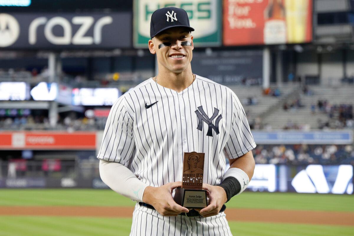 Aaron Judge, #99 of the New York Yankees, receives the New York Yankees' nomination for the Roberto Clemente Award before the first inning of the game against the Toronto Blue Jays at Yankee Stadium on Sept. 21, 2023, in the Bronx borough of New York City. (Sarah Stier/Getty Images)