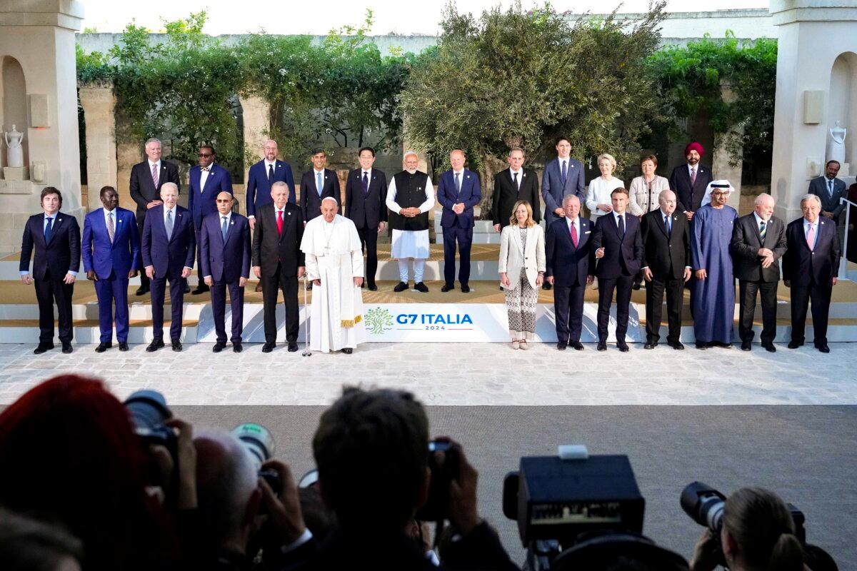 Pope Francis poses with the G7 heads of State and heads of delegation of Outreach countries and Charles Michel, president of the European Council and Ursula von der Leyen, president of the European Commission, for a family photo on day two of the 50th G7 summit at Borgo Egnazia in Fasano, Italy, on June 14, 2024. (Christopher Furlong/Getty Images)