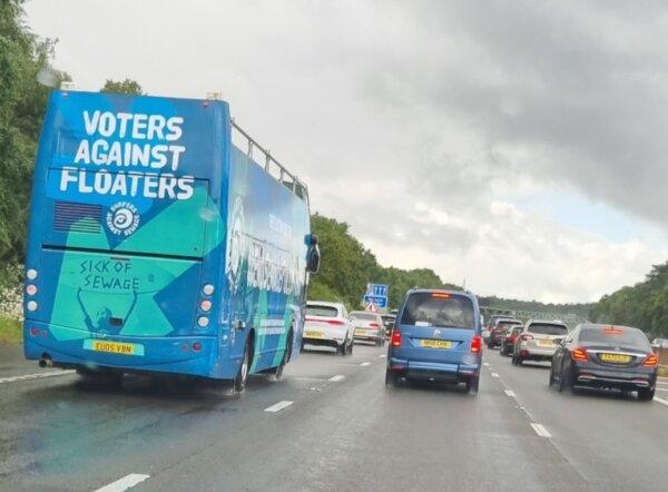 A Surfers Against Sewage campaign bus drives down the M3 in Hampshire, England, on June 15, 2024. (Chris Summers/The Epoch Times)