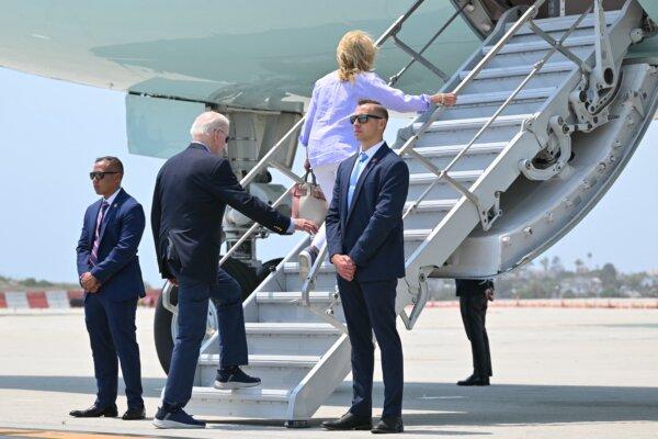 President Joe Biden and First Lady Jill Biden board Air Force One at Los Angeles International Airport on June 16, 2024. More than one-third of likely voters said they were "very interested" in the presidential debates. (Mandel Ngan / AFP)