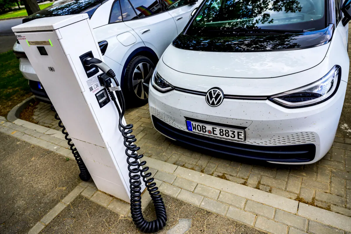 A Volkswagen electric car is parked in front of a charging station in Salzgitter, north-central Germany, on May 18, 2022. (John Macdougall/AFP via Getty Images)