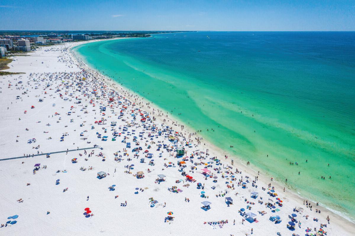 A busy day on the beach in Siesta Key, Fla. (Juergen_Wallstabe/Shutterstock)