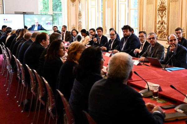France's Prime Minister Gabriel Attal (C) attends a meeting with liaison committees on the situation of French overseas territory of New-Caledonia, at the Matignon Hotel in Paris on May 17, 2024. (Julien De Rosa/POOL/AFP via Getty Images)