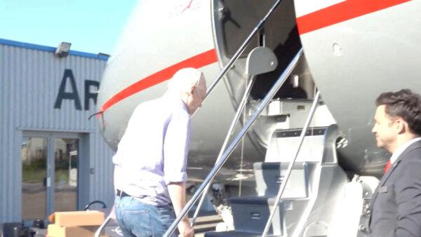 WikiLeaks founder Julian Assange boards a plane at a location given as London, Britain, in this still image from video released on June 25, 2024. ("@wikileaks" via X/Handout via Reuters)