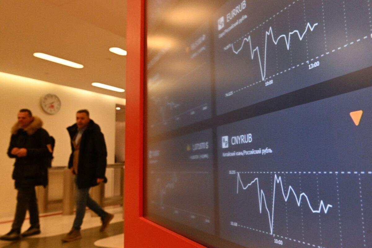 A screen shows the euro/ruble and the Chinese yuan/ruble exchange rates at the Moscow Exchange office in Moscow, on Jan. 10, 2023. (Krill Kudryavtsev/AFP via Getty Images)