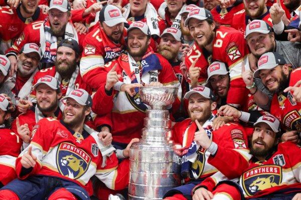 The Florida Panthers pose for a group shot after winning the Stanley Cup over the Edmonton Oilers in Game Seven of the 2024 Stanley Cup Final in Sunrise, Fla., on June 24, 2024. (Carmen Mandato/Getty Images)