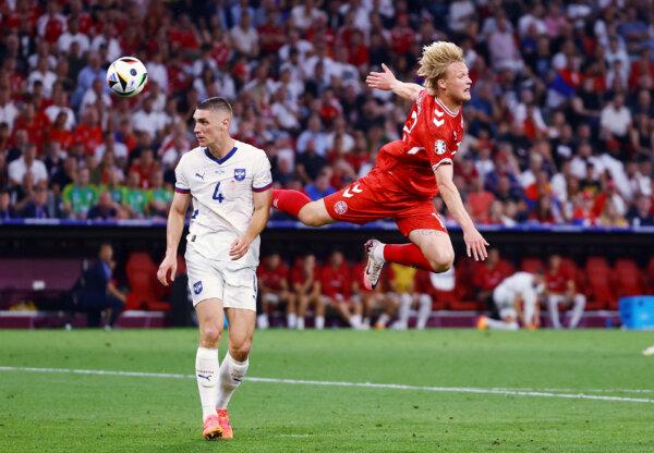 Serbia's Nikola Milenkovic in action with Denmark's Kasper Dolberg on June 25, 2024. (Leonhard Simon/Reuters)