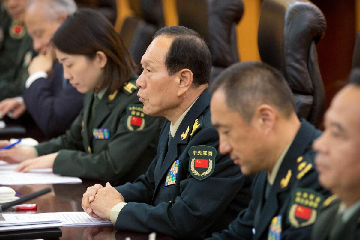 Chinese Defense Minister Wei Fenghe (C) talks with U.S. Defense Secretary Jim Mattis (not pictured) during their meeting at the Bayi building in Beijing on June 27, 2018. (Mark Schiefelbein/AFP via Getty Images)