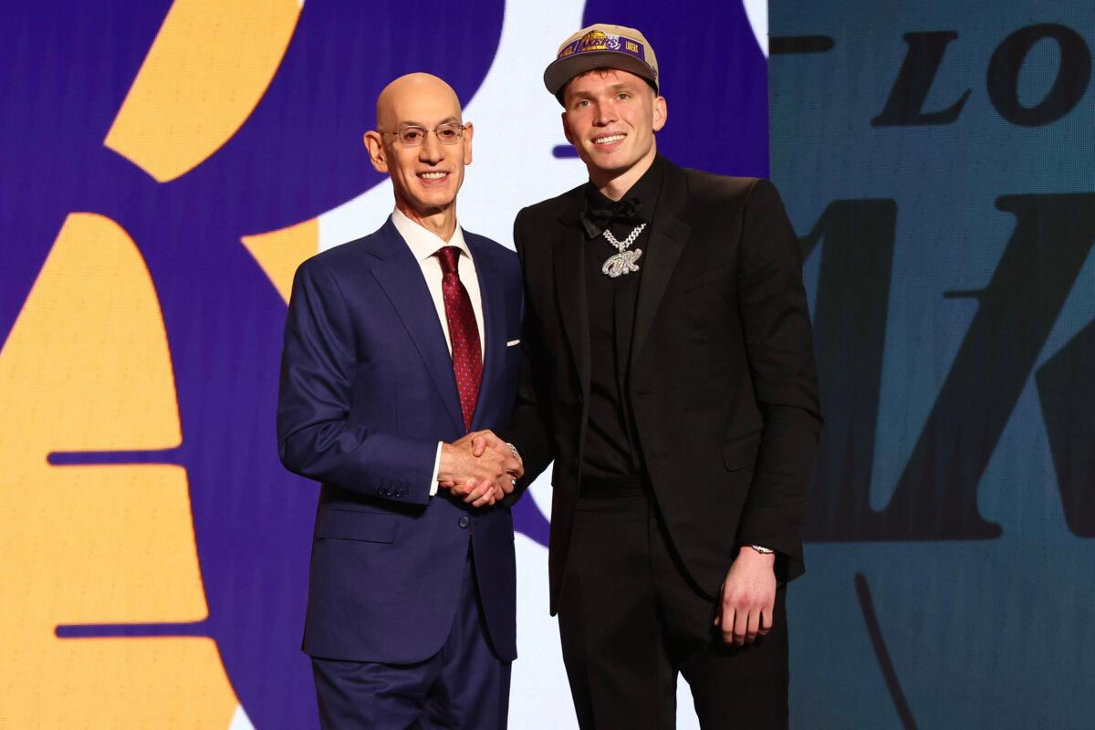 Dalton Knecht (R) shakes hands with NBA commissioner Adam Silver (L) after being drafted 17th overall by the Los Angeles Lakers during the first round of the 2024 NBA Draft at Barclays Center in the Brooklyn borough of New York City on June 26, 2024. (Sarah Stier/Getty Images)