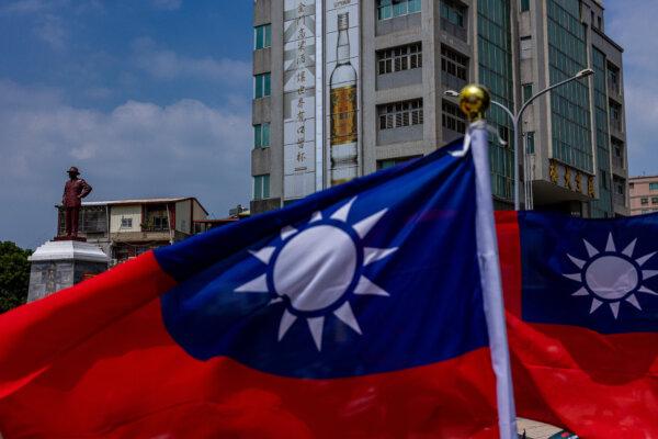 A bronze statue of former Chinese leader Chen Kai Shek will be seen behind the Taiwanese flag of Kinmen, Taiwan on September 24, 2022.