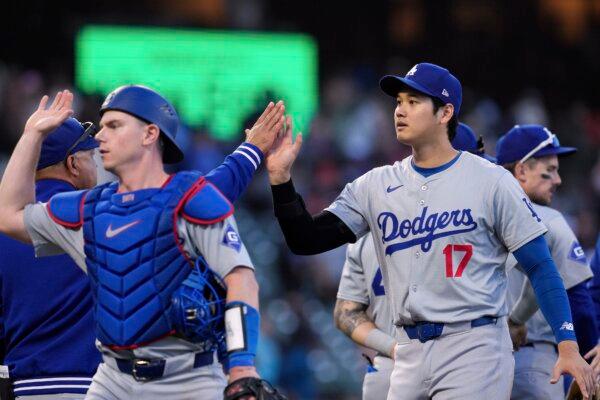 Los Angeles Dodgers' Shohei Ohtani (R) and Will Smith (L) celebrates with teammates after the victory over the San Francisco Giants in a baseball game in San Francisco on June 29, 2024. (Godofredo A. Vásquez/AP Photo)