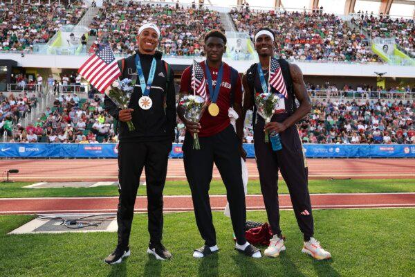 Silver medalist Russell Robinson, gold medalist Salif Mane, and bronze medalist Donald Scott pose with their medals after competing in the men's triple jump final on Day Ten of the 2024 U.S. Olympic Team Track & Field Trials in Eugene, Oregon on June 30, 2024. (Christian Petersen/Getty Images)