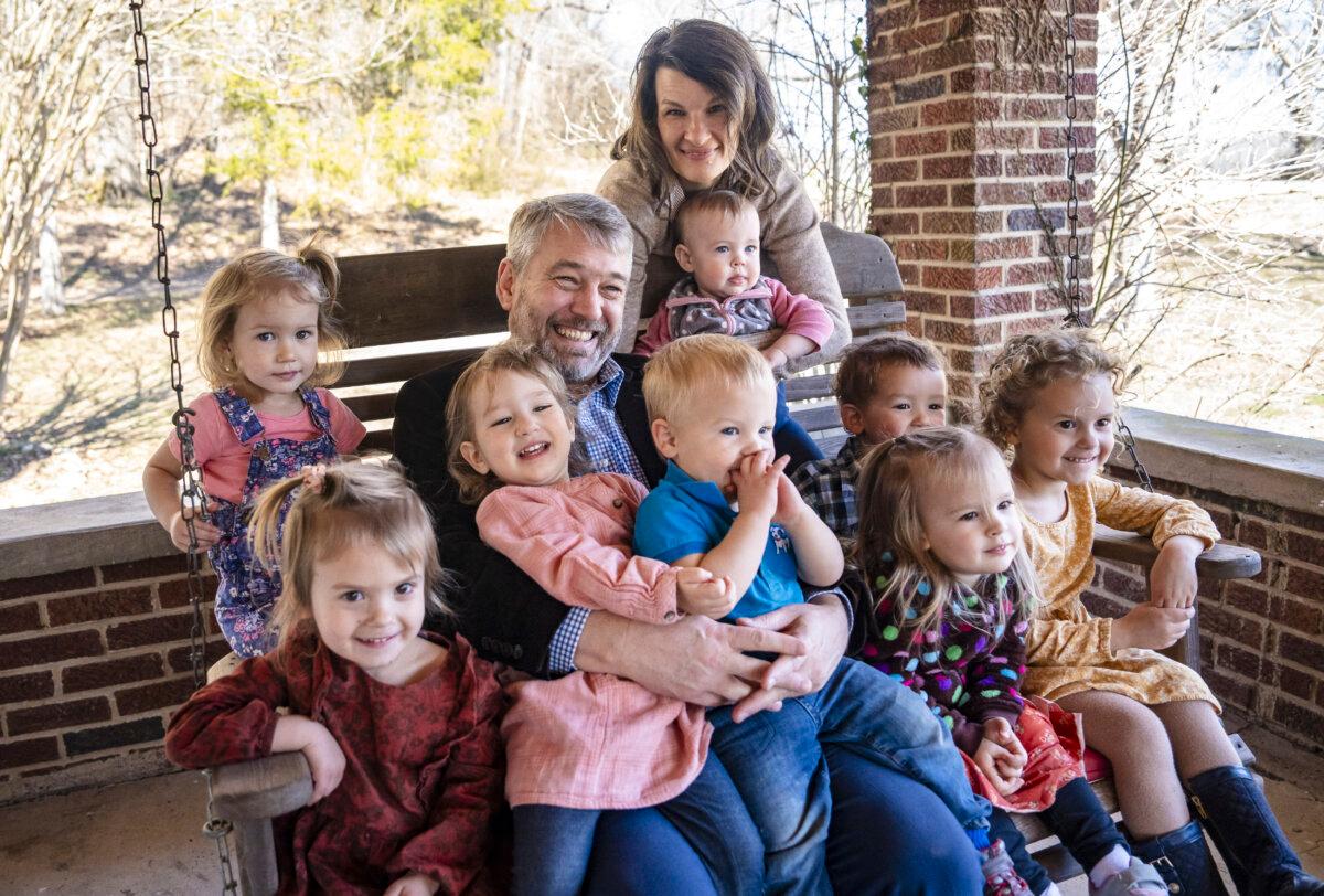 Paul and Bethany Vaughn at their home with their daughter and some of their grandchildren in Centerville, Tenn., on Feb. 20, 2024. (Samira Bouaou/The Epoch Times)