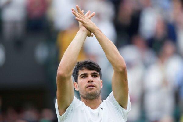 Carlos Alcaraz celebrates after defeating Aleksandar Vukic in a second-round Wimbledon match in London on July 3, 2024. (Mosa'ab Elshamy/AP Photo)