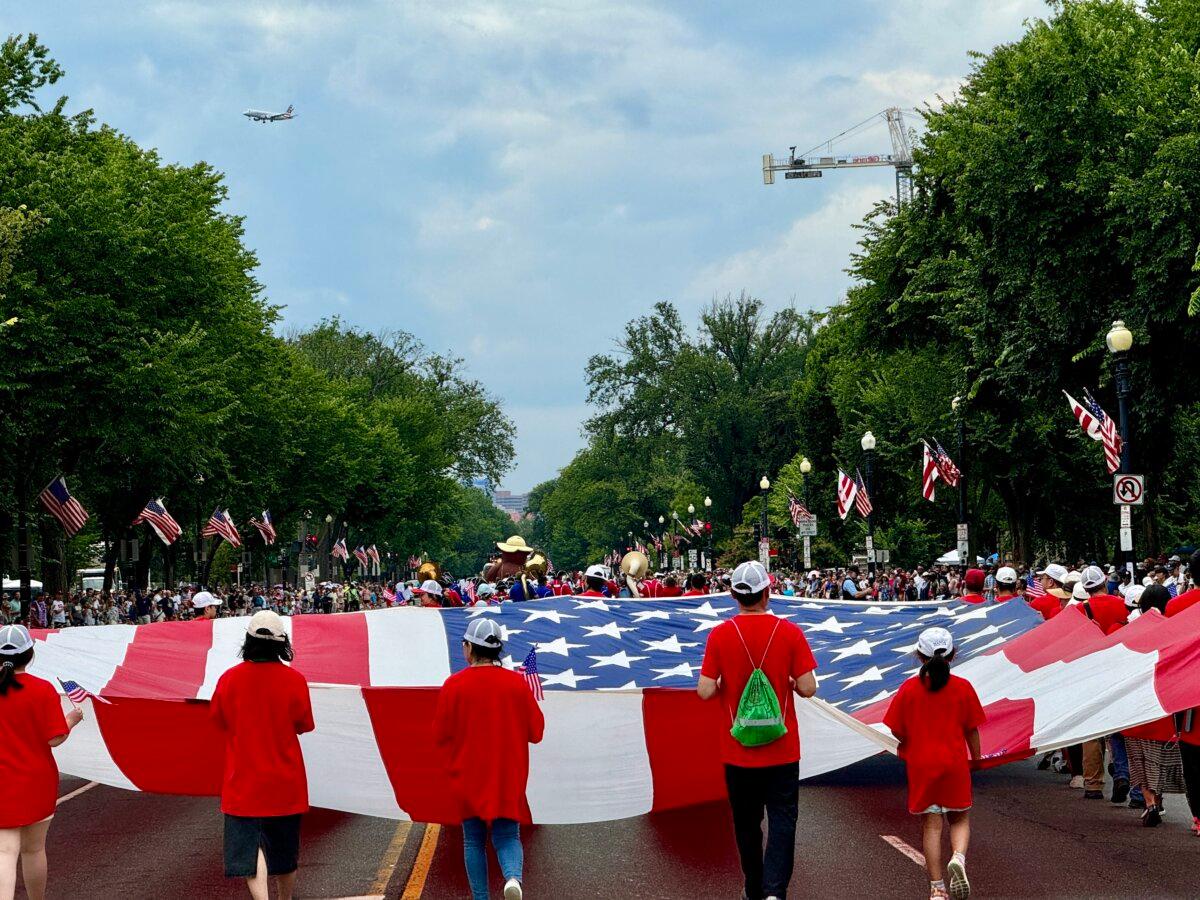 People take part in a parade during celebrations marking Independence Day in Washington on July 4, 2024. (Daniel Slim/AFP via Getty Images)