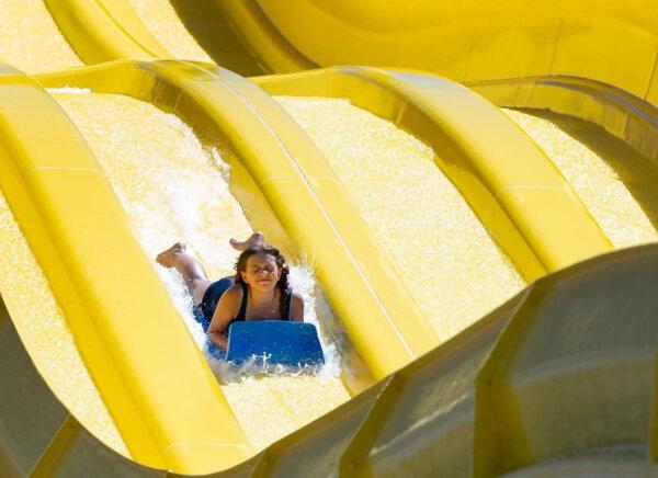 A girl goes down a water slide at Roaring Springs Waterpark in Meridian, Idaho, the largest waterpark in the Northwest region. (Sarah A. Miller/Idaho Statesman/TNS)