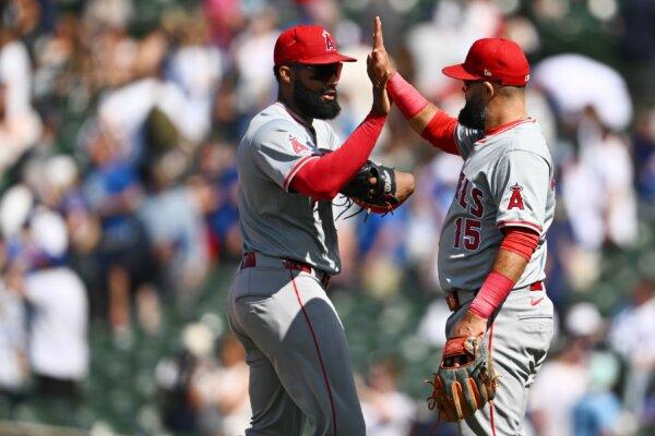 Jo Adell (7) and Luis Guillorme (15) of the Los Angeles Angels celebrate after a win against the Chicago Cubs in Chicago on July 6, 2024. (Quinn Harris/Getty Images)