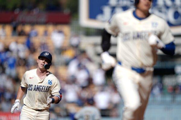 Will Smith (16) and Shohei Ohtani (17) of the Los Angeles Dodgers run the bases after Smith hit a two run home run against the Milwaukee Brewers during the first inning in Los Angeles on July 6, 2024. (Michael Owens/Getty Images)