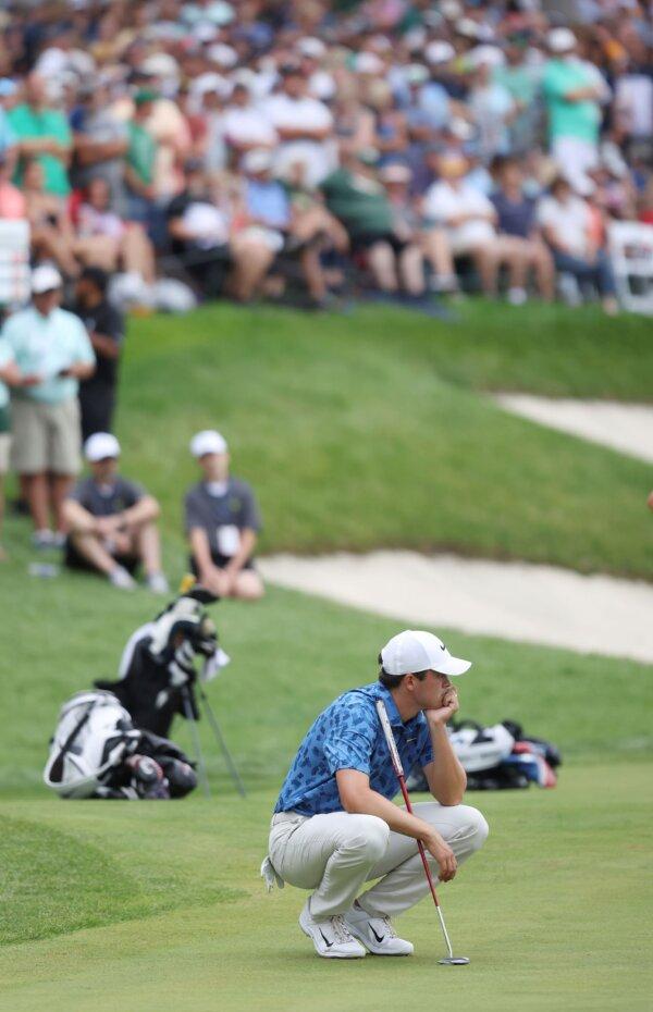 Davis Thompson pauses before his final putt at the John Deere Classic in Silvis, Ill., on July 7, 2024. (Roy Dabner/Quad City Times via AP)