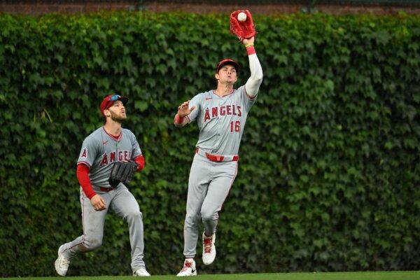 Mickey Moniak (16) of the Los Angeles Angels catches a fly ball next to teammate Taylor Ward (3) in the eighth inning against the Chicago Cubs in Chicago on July 7, 2024. (Jamie Sabau/Getty Images)