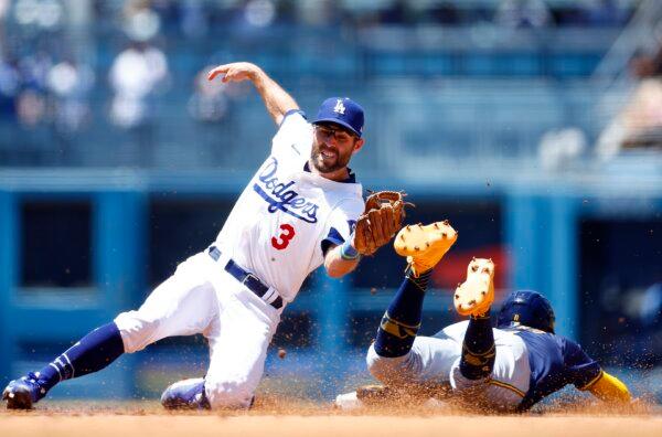 Jackson Chourio (11) of the Milwaukee Brewers steals second base against Chris Taylor (3) of the Los Angeles Dodgers in the fourth inning in Los Angeles on July 7, 2024. (Ronald Martinez/Getty Images)