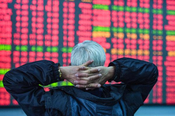 An investor looks at a screen showing stock market movements at a securities company in Hangzhou, in eastern China's Zhejiang Province, on Feb. 8, 2024. (STR/AFP via Getty Images)