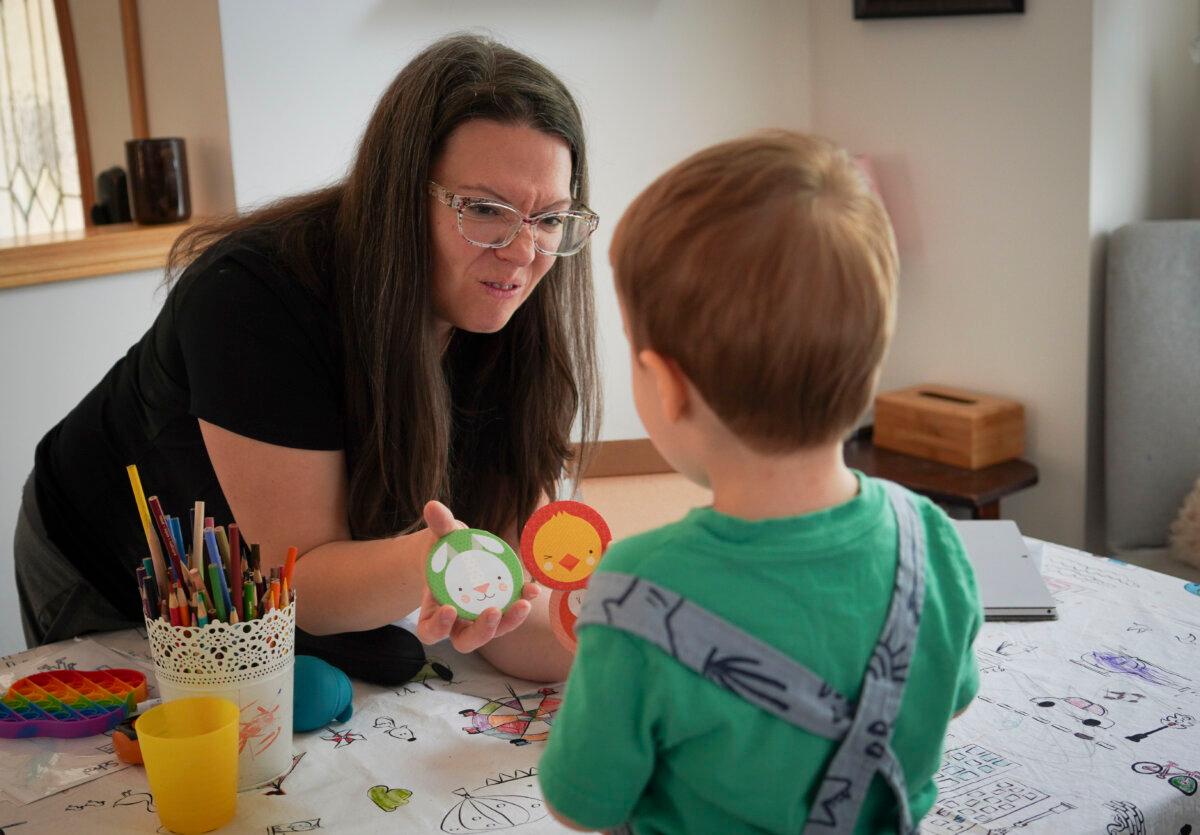Danielle Brandt with her youngest son, Silas, at her Calgary home on June 1, 2024. Mrs. Brandt homeschools her oldest son, Aiden, because she saw he was falling behind in class. Seeing the positive response, she now plans to also homeschool her other two children. (Carolina Avendano/The Epoch Times)