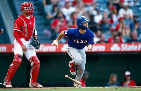 Josh Smith (8) of the Texas Rangers hits a home run against the Los Angeles Angels in the first inning in Anaheim, Calif., on July 9, 2024. (Ronald Martinez/Getty Images)