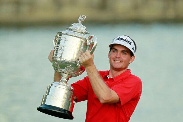 Keegan Bradley celebrates with the Wanamaker Trophy after winning a three-hole playoff over Jason Dufner during the final round of the 93rd PGA Championship at the Atlanta Athletic Club in Johns Creek, Ga., on Aug. 14, 2011. (Kevin Cox/Getty Images)