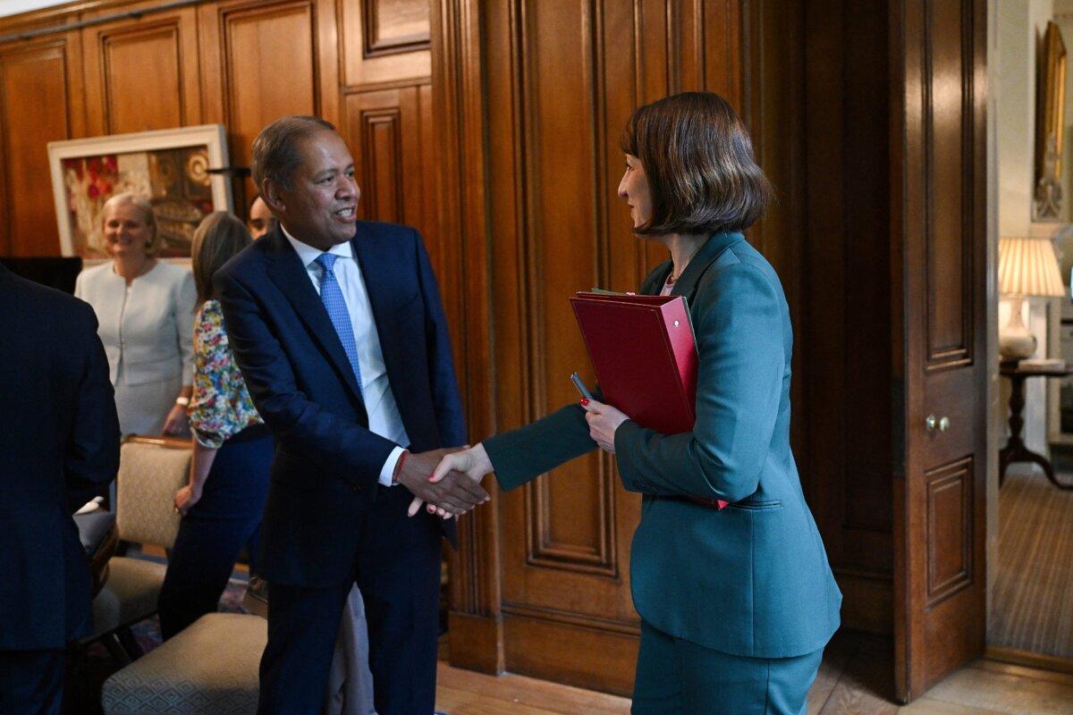 Britain's Chancellor of the Exchequer Rachel Reeves (R) shakes hands with Barclays Chief Executive C.S. Venkatakrishnan at the start of a meeting of the National Wealth Fund Taskforce at 11 Downing Street in London on July 9, 2024. (Justin Tallis/Pool/AFP via Getty Images)
