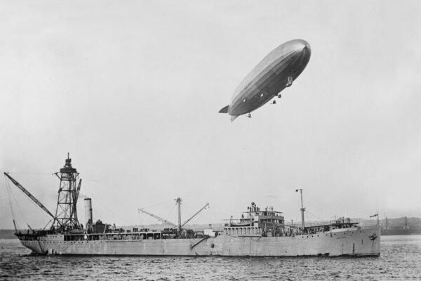 The USS Shenandoah flies over its supply tender. (Public Domain)