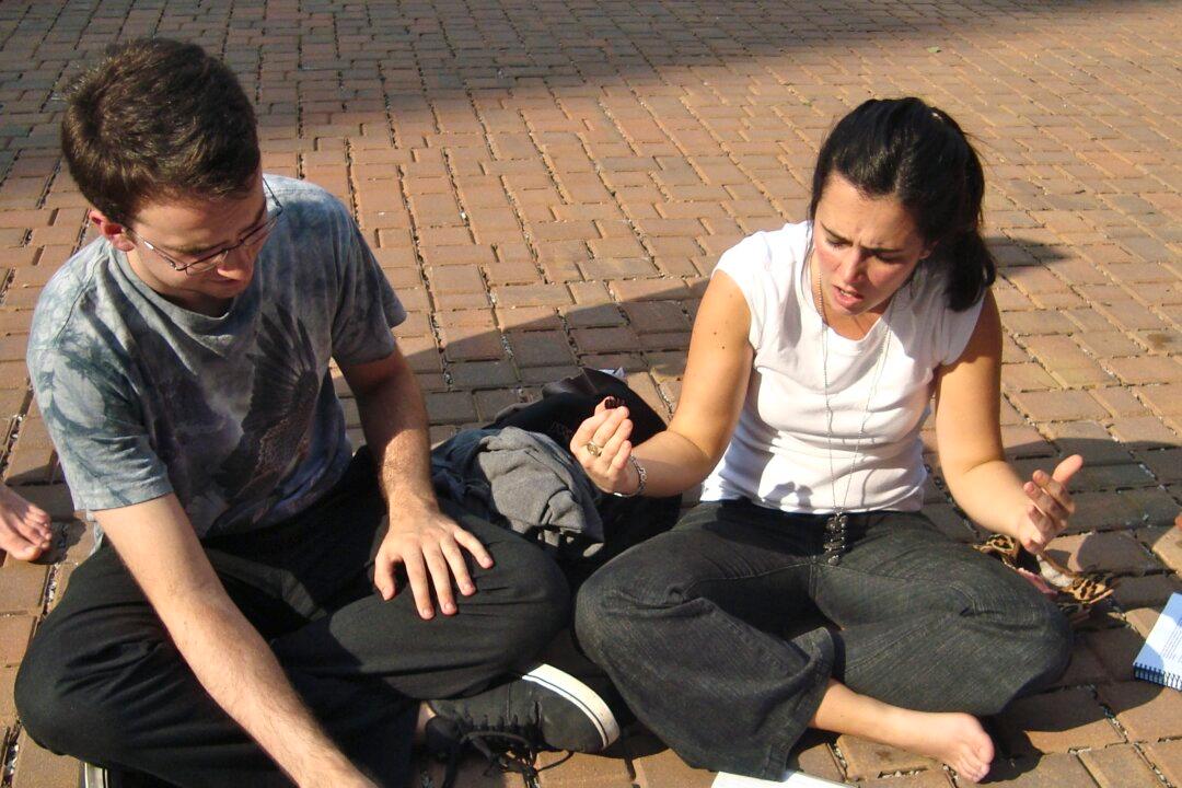 Brendan Moore and Marina Coll explain their thoughts during a Socratic discussion of "The Objectivist Ethics." (Courtesy of Marsha Enright)