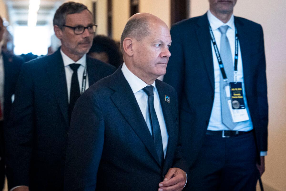 German Chancellor Olaf Scholz leaves after meeting with lawmakers and NATO leaders during a visit to Washington on July 10, 2024. (Madalina Vasiliu/The Epoch Times)