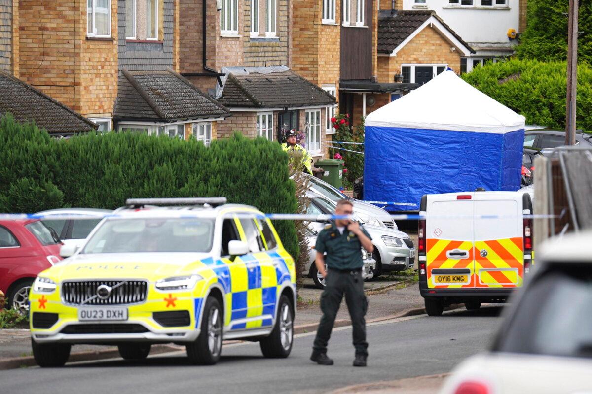 Police and emergency services at the scene in Ashlyn Close, after an incident on Tuesday evening, in Bushey, Hertfordshire, England, on July 10, 2024. (James Manning/PA via AP)