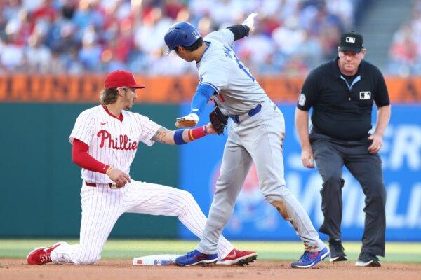 Shohei Ohtani (17) of the Los Angeles Dodgers reacts after stealing second base against Bryson Stott (5) of the Philadelphia Phillies in Philadelphia on July 10, 2024. (Heather Barry/Getty Images)