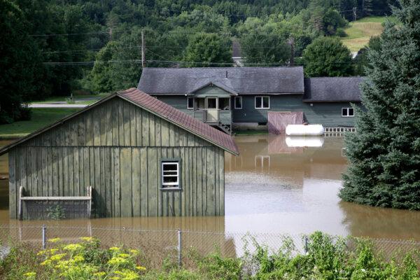 Water floods the lower level of homes in Waterbury, Vt., on July 11, 2024. (Hasan Jamali/AP Photo)