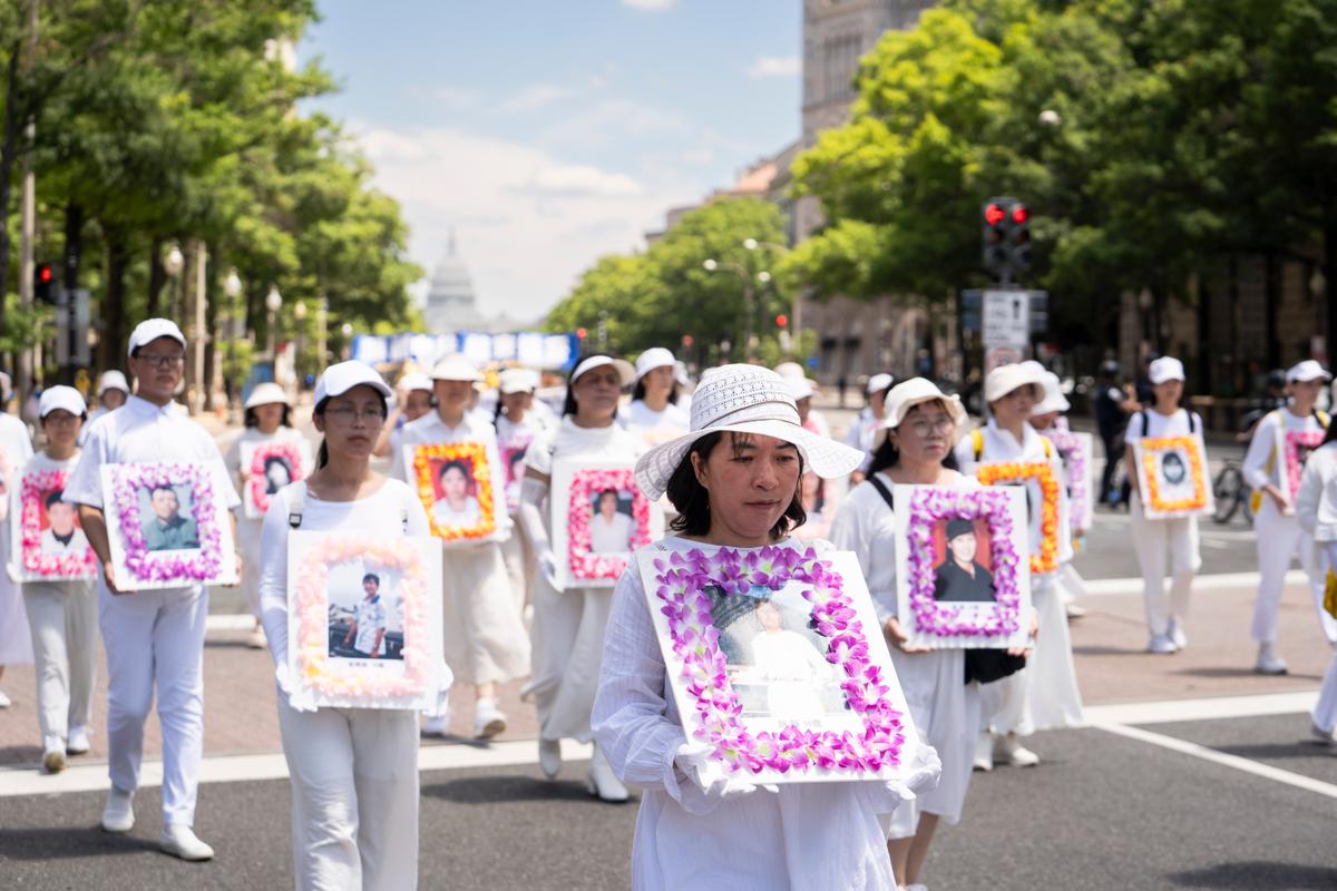 Falun Gong practitioners march during a parade calling for an end to the Chinese Communist Partyâs 25-year-long persecution of the spiritual practice in Washington on July 11, 2024. (Madalina Vasiliu/The Epoch Times)