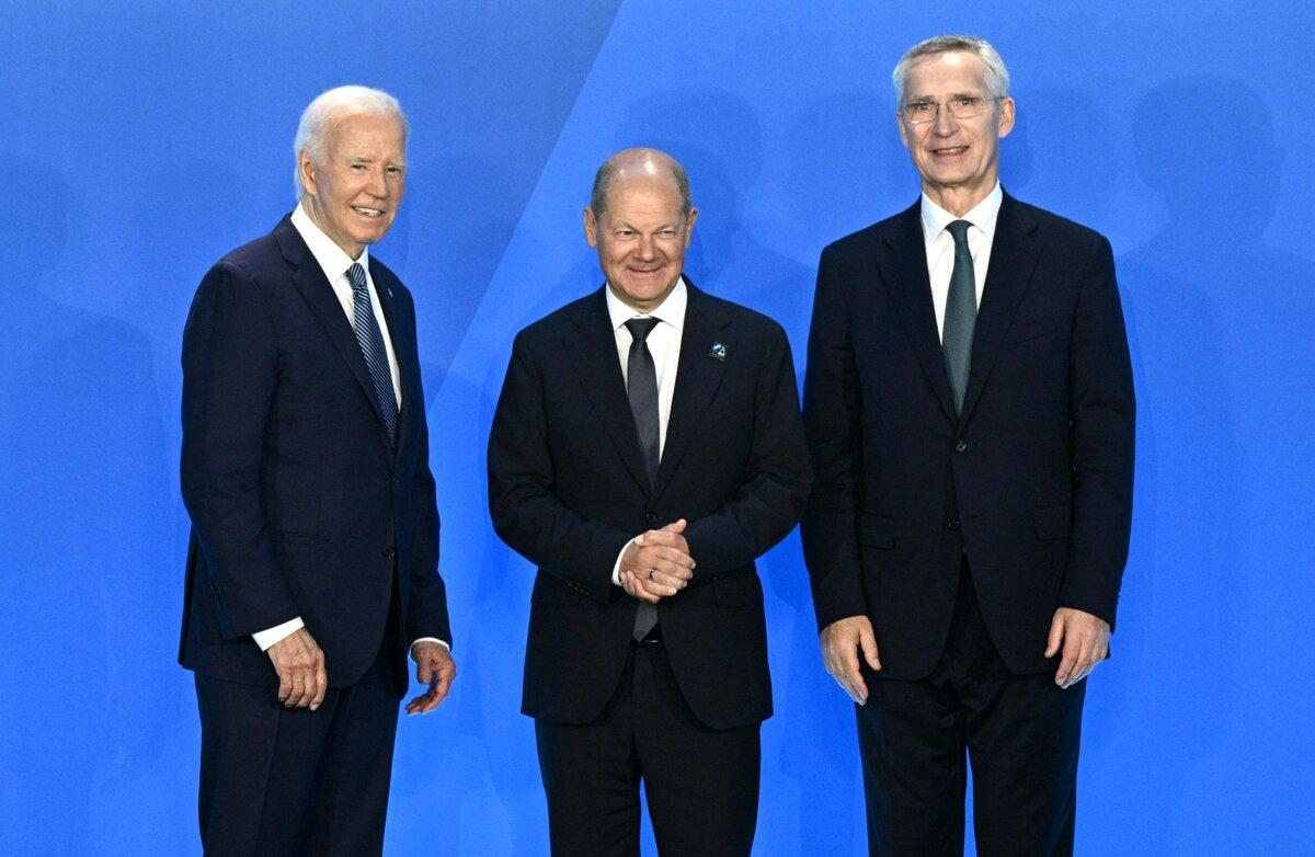 German Chancellor Olaf Scholz (C) is welcomed by U.S. President Joe Biden (L), and NATO Secretary-General Jens Stoltenberg during the NATO 75th anniversary summit in Washington on July 10, 2024. (Brendan Smialowski/AFP via Getty Images)
