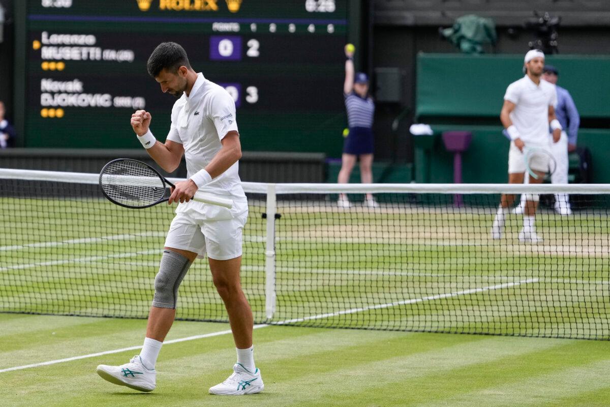 Novak Djokovic of Serbia reacts during his semifinal match against Lorenzo Musetti of Italy at the Wimbledon tennis championships in London on July 12, 2024. (Alberto Pezzali/AP Photo)