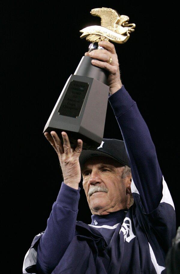 Manager Jim Leyland of the Detroit Tigers holds up the American League Championship trophy after the Tigers 6–3 win against the Oakland Athletics during Game Four of the American League Championship Series in Detroit, Mich., on Oct. 14, 2006. (Jim McIsaac/Getty Images)