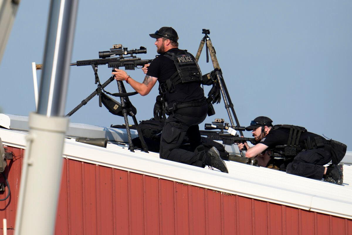 Police snipers return fire after former President Donald Trump was shot at the campaign event. (Gene J. Puskar/AP Photo)