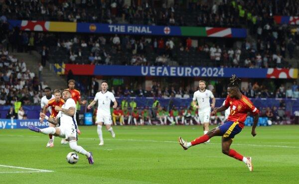Nico Williams of Spain scores his team's first goal whilst under pressure from Kyle Walker of England during the UEFA EURO 2024 final match between Spain and England in Berlin on July 14, 2024. (Richard Pelham/Getty Images)