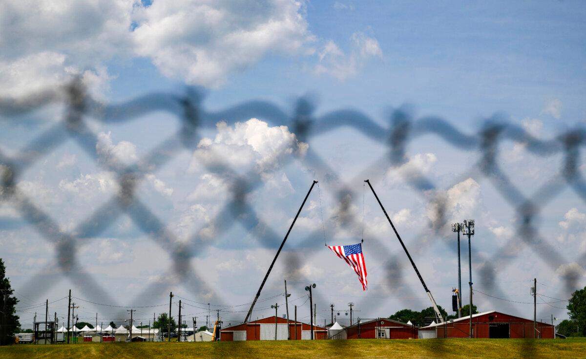 The American flag, which served as the backdrop for a campaign rally by former President and then-Republican candidate Donald J. Trump, blows in the wind at Butler Fairgrounds in the aftermath of the attempted assassination of the former president in Butler, Pa., on July 14, 2024. (Jeff Swensen/Getty Images)