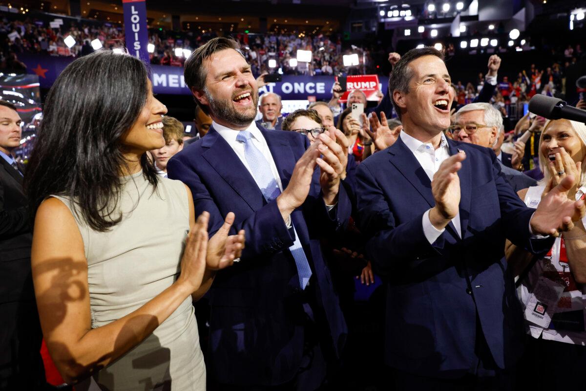 Sen. J.D. Vance (R-Ohio) celebrates his nomination for the office of Vice President alongside his wife Usha Chilukuri Vance and Ohio Delegate Bernie Moreno on the first day of the Republican National Convention at the Fiserv Forum in Milwaukee, Wis., on July 15, 2024. (Anna Moneymaker/Getty Images)