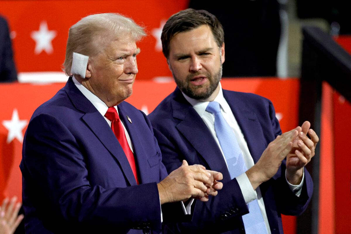 Former President and 2024 Republican presidential candidate Donald Trump (L) chats with Senator from Ohio and 2024 Republican vice-president candidate J. D. Vance (R) during the first day of the 2024 Republican National Convention at the Fiserv Forum in Milwaukee, Wis., on July 15, 2024. (Kamil Krzaczynski/AFP via Getty Images)
