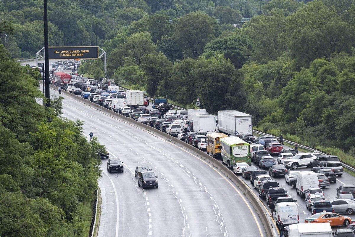 Traffic backs up on the Don Valley Parkway due to flooding following heavy rain in Toronto, on July 16 2024. (The Canadian Press/Arlyn McAdorey)