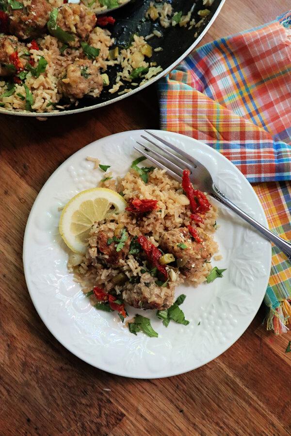 Turkey meatballs and fiber-rich brown rice cooked in chicken broth and lemon is a simple but hearty meal that's full of protein. (Gretchen McKay/Pittsburgh Post-Gazette/TNS)