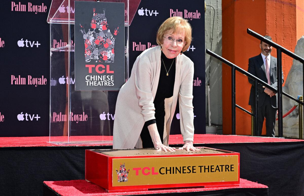 Comedian and actress Carol Burnett puts her hands into the block of cement during her Hand and Footprint ceremony in the courtyard of the TCL Chinese Theater in Hollywood, Calif., on June 20, 2024. (Frederic J. Brown/AFP via Getty Images)