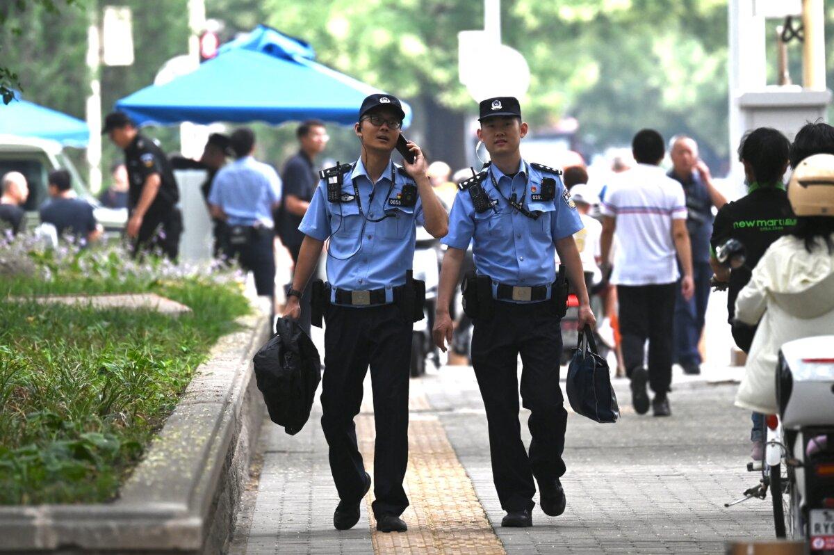 Police officers patrol outside the Jingxi hotel in Beijing on July 15th, 2024 (Greg Baker/AFP via Getty Images)